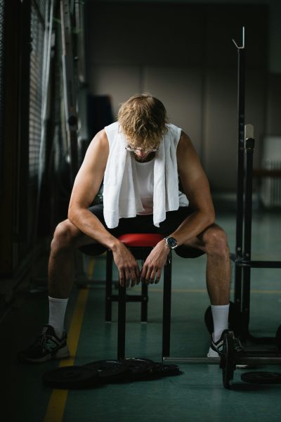 Photo by Sinitta Leunen: https://www.pexels.com/photo/tired-man-athlete-resting-on-bench-5496591/